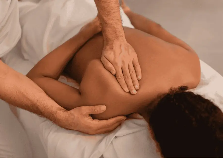 Therapist giving a deep tissue back massage