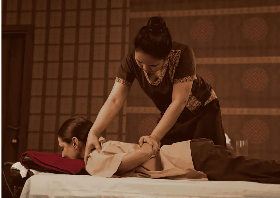 Therapist giving a Thai massage